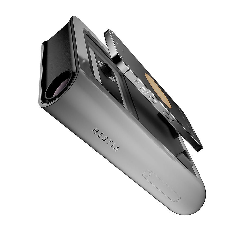 The image shows a close-up of a Hestia phone, which is a small, rectangular device. The phone is open, revealing its features, such as a camera and a screen. The Hestia phone is designed to be compact and easy to use, making it a convenient choice for those who want a functional device without the bulkiness of larger smartphones.