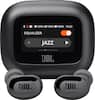 The image features a black JBL speaker with an equalizer setting for jazz. The speaker has a display screen showing the equalizer settings, and it is accompanied by two black earphones. The speaker is placed on a white background, and the time displayed on the screen is 16:52.
