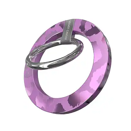 The image features a purple ring with a silver band. The ring is made of metal and has a unique design. The ring is displayed on a white background, which highlights its color and details.