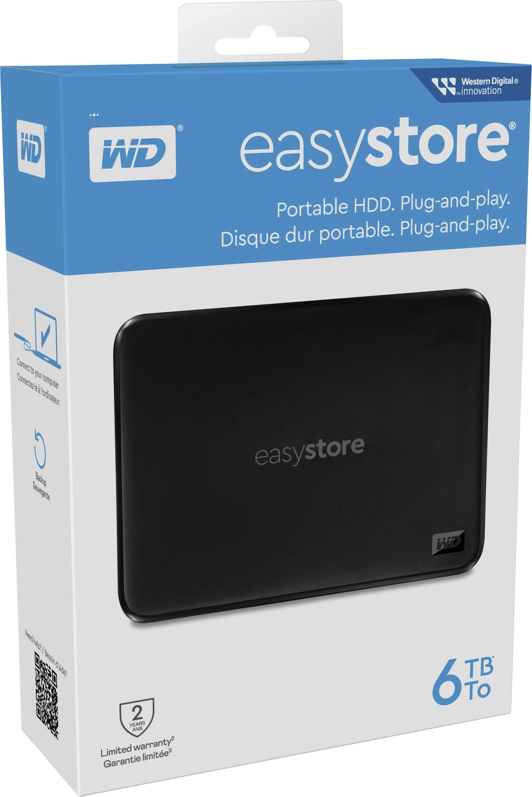 The image features a WD EasyStore portable hard drive, which is a plug-and-play device. The hard drive is black and has a capacity of 6 TB. It is designed for easy storage and transfer of data, making it a convenient solution for users who need to store and transport large amounts of data. The packaging for the WD EasyStore portable hard drive is white, and it comes with a limited warranty.