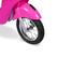 The image features a pink motorcycle with a black tire. The motorcycle is parked on a white background, and the tire is prominently displayed in the foreground. The tire is described as being black and having a silver rim.