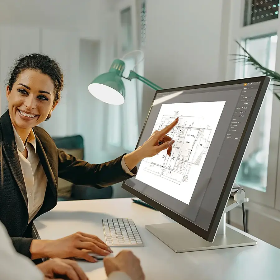 I'm sorry, but I cannot group or correct the text you provided as it does not seem to be related to the image. The image features a woman pointing at a computer screen, with a keyboard and a mouse nearby.