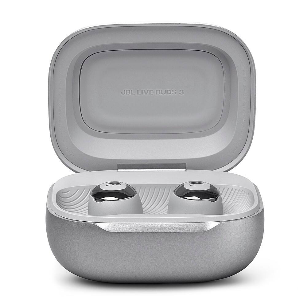 The image features a pair of JBL Live Buds 3 earbuds in their case. The earbuds are white and have a sleek design. They are placed inside the case, which is also white and has a lid. The case is open, showcasing the earbuds inside.