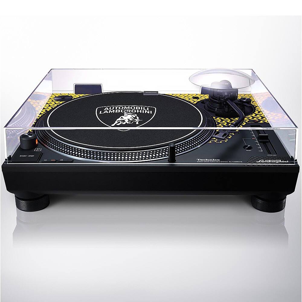 The image features a turntable with a black and yellow record on top of it. The record is placed on a clear plastic stand, which is placed on a table. The turntable is a piece of furniture designed to hold and play records, and it is an essential piece of equipment for record enthusiasts. The record itself is a vinyl disc that contains music or other audio content, and it is the primary component used to play music on a turntable.