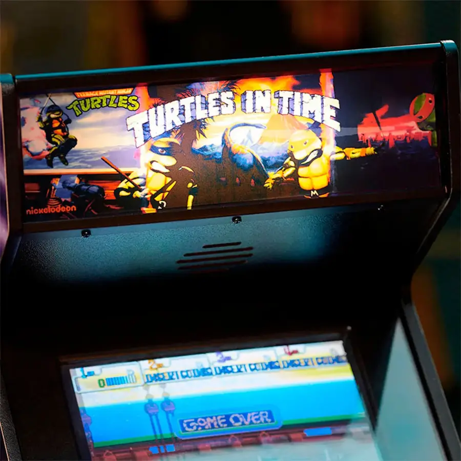 The image features a video game machine with a game called "Teenage Mutant Ninja Turtles in Time." The game is displayed on a screen, and the machine is ready for players to enjoy the game.