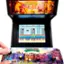 The image features a video game machine with a Teenage Mutant Ninja Turtles game displayed on the screen. The game machine is designed to accept coins and has buttons on the front for gameplay. The machine is open, revealing the game's controls and the game's title. The game is set in a city environment with buildings in the background.