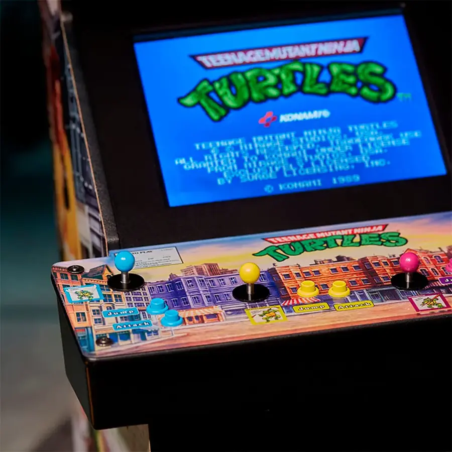 The image features a video game machine with a screen displaying the Teenage Mutant Ninja Turtles game. The game machine has a keyboard and a joystick, allowing players to control the game. The machine is designed to resemble an arcade game, and it is likely that it is a replica of the original arcade game. The game is rated PG, indicating that it is suitable for players of all ages.