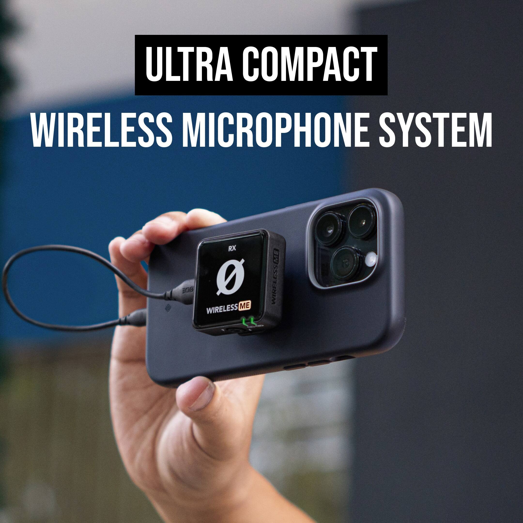 The image features a person holding a small electronic device, likely a wireless microphone system, in their hand. The device is attached to a cell phone, and the person is holding it up to the camera. The text "ULTRA COMPACT WIRELESS MICROPHONE SYSTEM" is displayed prominently in the image, emphasizing the device's compact and wireless capabilities.