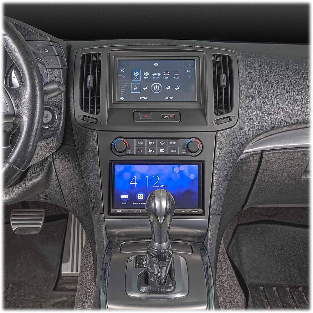 The image shows the dashboard of a car with a clock displaying the time as 4:12. The car has a steering wheel and a gear shift, which are essential components for driving. The dashboard also features a radio and a display screen, providing entertainment and information to the driver. The car is likely a modern vehicle with advanced technology and features, such as the Sync Auto Art Top, which enhances the driving experience.