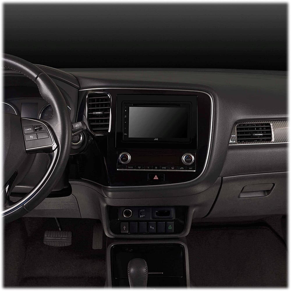 The image shows the interior of a car with a dashboard and a steering wheel. The dashboard has a large screen in the middle, which is likely a display for the car's navigation system. The steering wheel is positioned in front of the dashboard, and the car's controls are located on the dashboard. The car's interior is designed to provide a comfortable and functional driving experience.