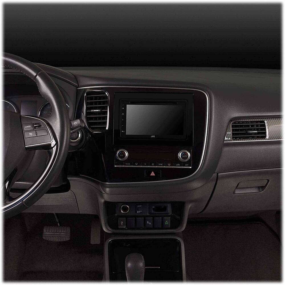 The image shows the interior of a car with a dashboard and a steering wheel. The dashboard has a large screen in the middle, which is likely a display for the car's navigation system. The steering wheel is positioned in front of the dashboard, and the car's controls are located on the dashboard. The car's interior is designed to provide a comfortable and functional driving experience.