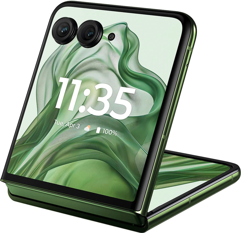 The image shows a green cell phone with a green case. The time displayed on the screen is 11:35. The phone is open and placed on a table.