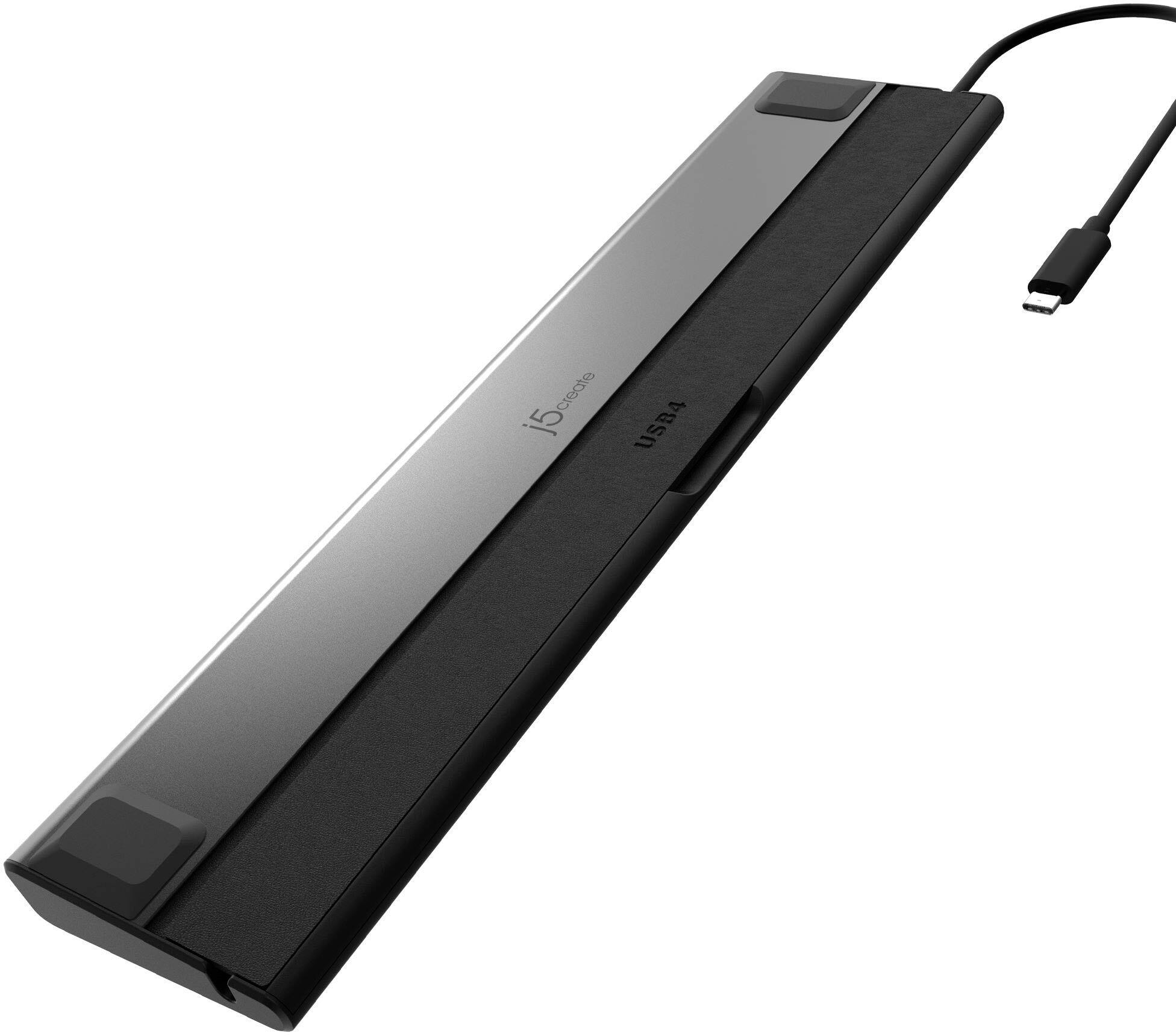 The image features a laptop docking station, which is designed to connect a laptop to a desktop computer. The docking station is black and has a USB 4 port, allowing for faster data transfer and charging capabilities. The station is connected to the laptop via a cable, and it is placed on a white background.