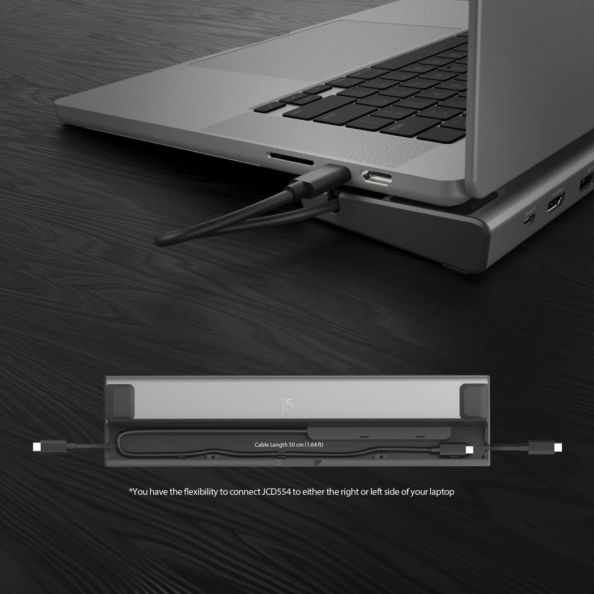 The image features a laptop with a docking station attached to it. The docking station has a cable length of 50 cm and allows for flexibility in connecting it to either the right or left side of the laptop. The laptop is placed on a wooden surface, and the docking station is clearly visible, providing a convenient way to expand the functionality of the laptop.