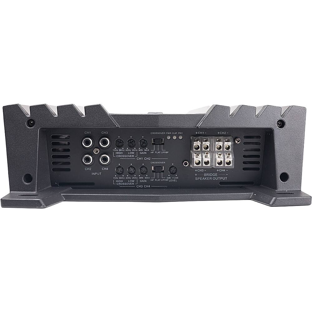 The image shows a black electronic device with a variety of ports and connections. The device has a crossover switch, which allows for adjusting the frequency response of the speakers. The crossover switch is located on the top of the device, and there are multiple ports and connections available, including a bridge speaker output. The device is designed to provide a high-quality audio experience for users.