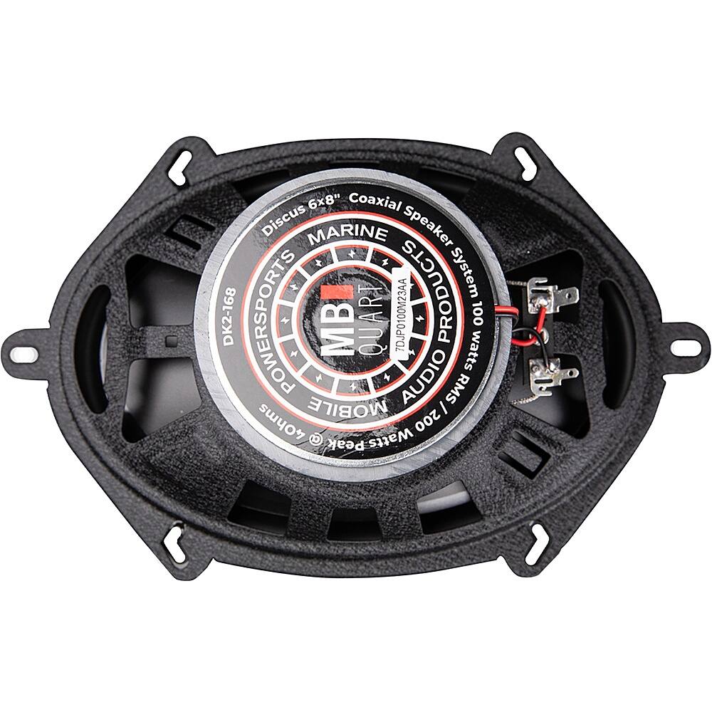 The image features a black and silver speaker with a sticker on it that says "MB Quart." The speaker is designed for marine use and has a power rating of 100 watts RMS and 200 watts peak. The speaker is part of a coaxial discus marine speaker system, and it is suitable for use in a mobile audio setup.