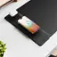 The image shows a smartphone placed on a charging station, which is connected to a power source. The phone is charging and displays a battery level of 70%. The charging station is positioned on a table, and the phone is sitting on top of it.