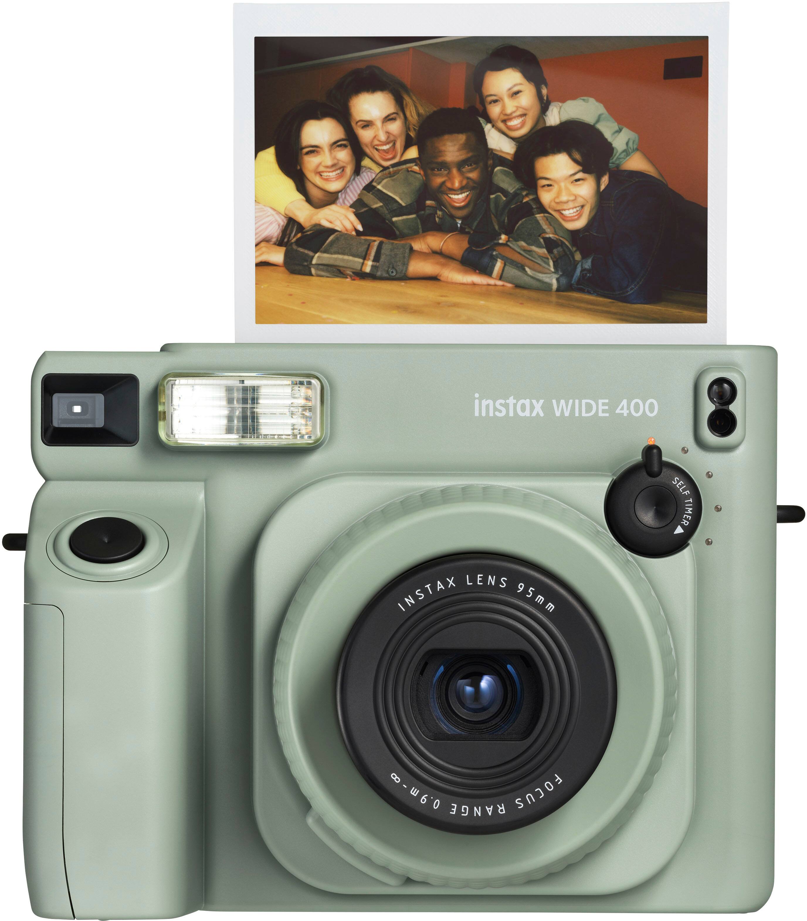 The text on the image reads "instax WIDE 400 SELF TIMER LENS INSTAX 95mm -w60 RANGE FOCUS."