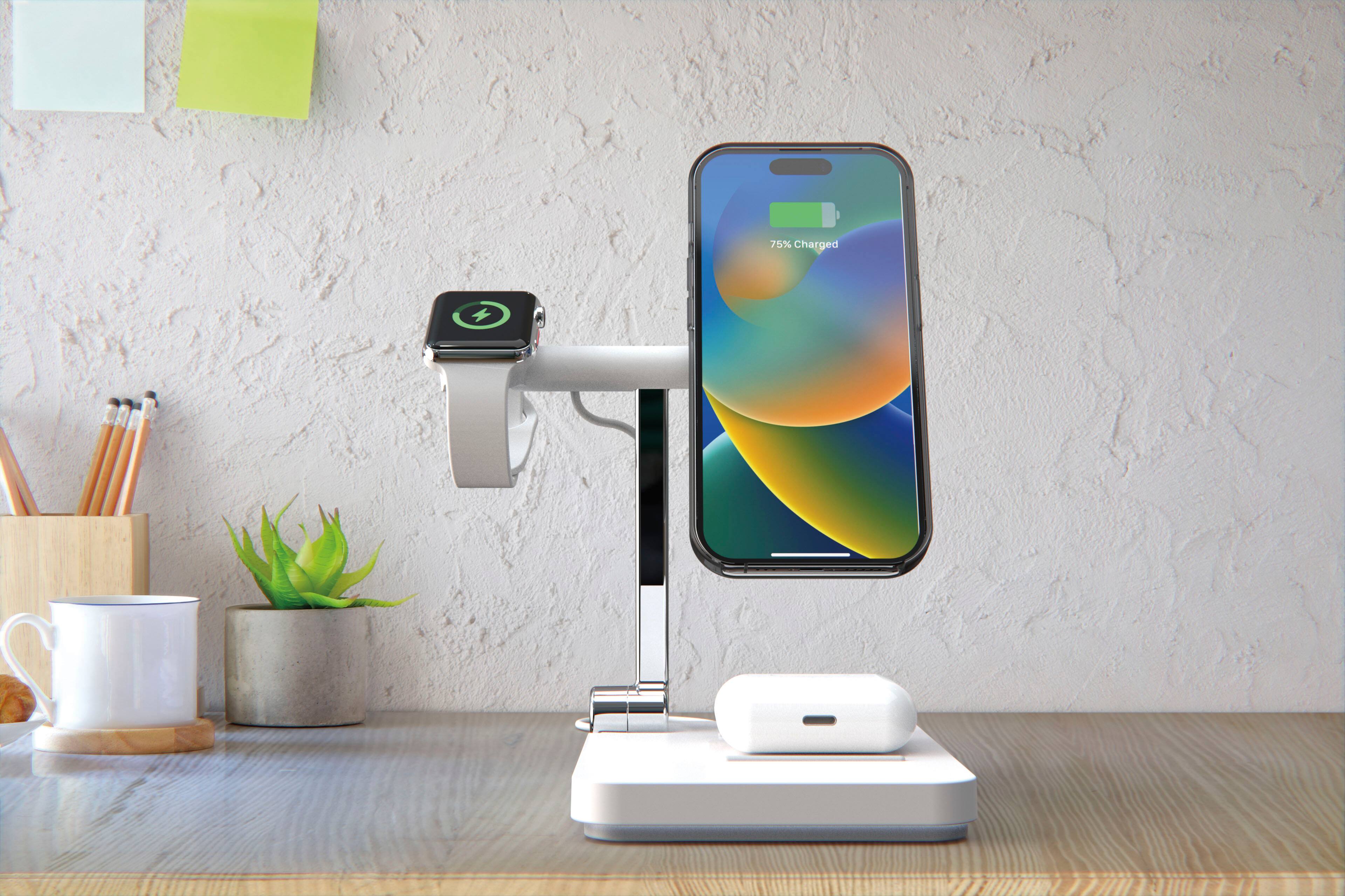 The image shows a smartphone placed on a charging station, which is connected to a wall outlet. The phone is charging and has a battery level of 75%.