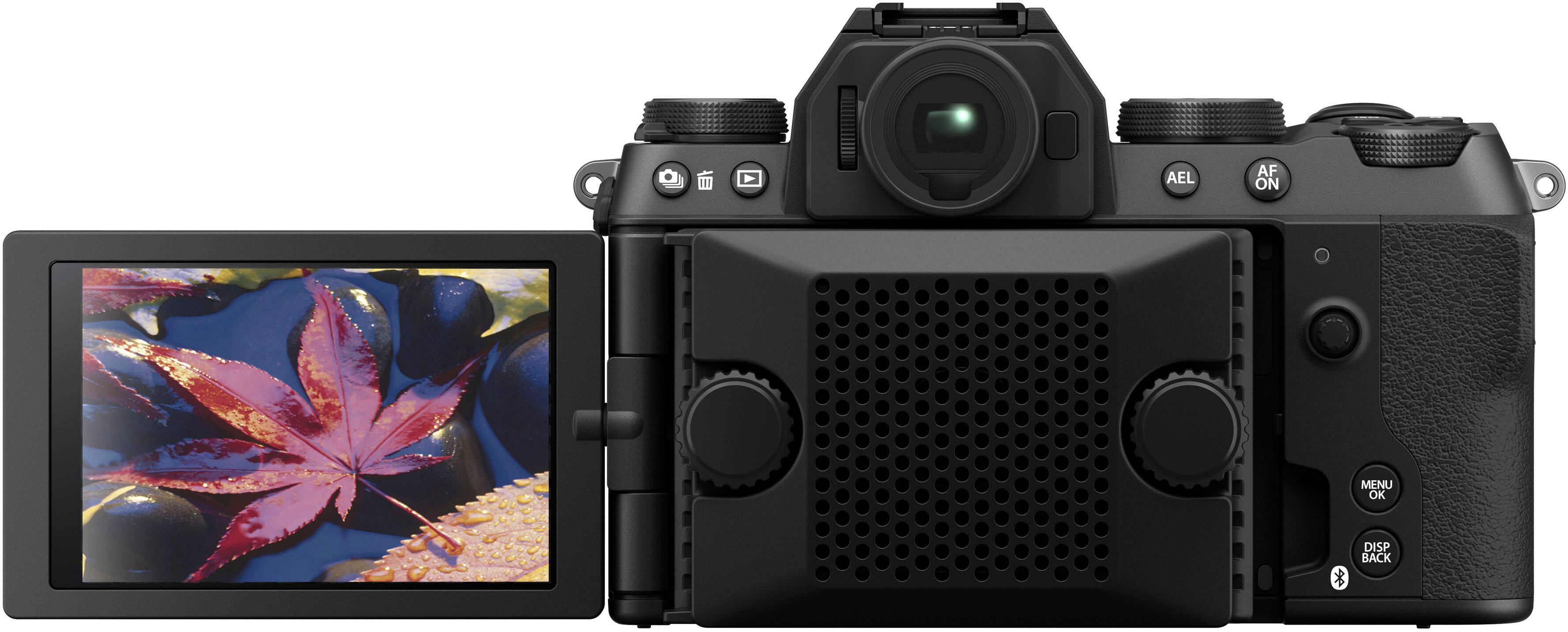The image features a black digital camera with a large screen on the front. The camera is turned on and ready to take pictures. The screen is likely used for displaying images or information related to the camera's settings and functions. The camera is positioned on a white background, which helps to emphasize its features and design.
