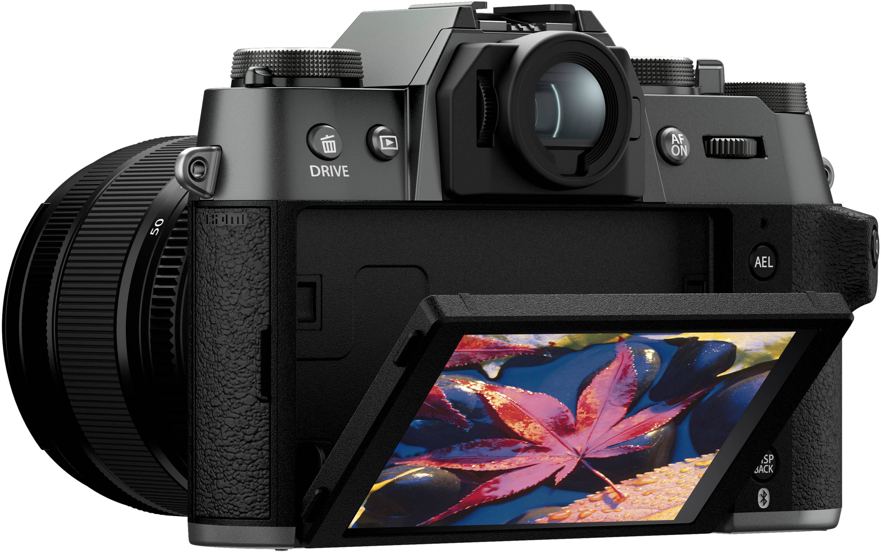 The image features a black digital camera with a large lens. The camera is turned on and ready for use. The lens is positioned in front of the camera, and the camera is sitting on a surface. The camera appears to be a professional-grade device, suitable for capturing high-quality images and videos.