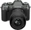 The image features a close-up of a Fujifilm X-T50 camera with a Fujinon lens. The camera is black and has a large lens on the front, making it a high-quality digital camera. The lens is described as an aspherical lens, which is known for its ability to correct distortions and provide sharp images. The camera is designed for capturing stunning images and is a popular choice among photographers.