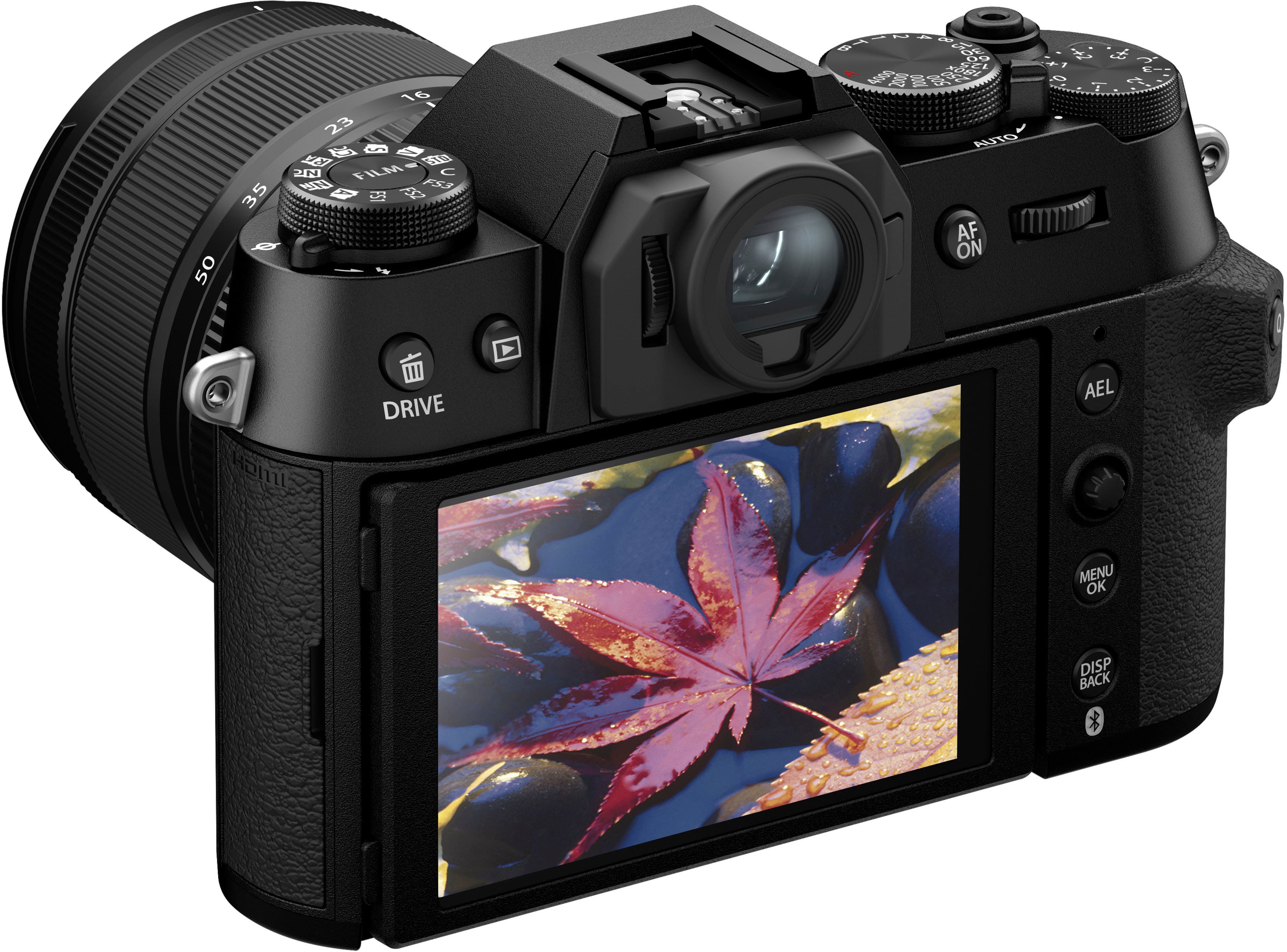 The image features a black digital camera with a large screen on the front. The camera has a viewfinder, which is a small screen on the top of the camera that allows the user to see the image they are capturing. The camera also has a display screen on the back, which is used for reviewing photos and adjusting settings. The camera has a variety of buttons, including a menu button and a back button, which are used to navigate and access different settings and functions. Additionally, the camera has a drive mode, which allows the user to continuously take photos without stopping to review each one.