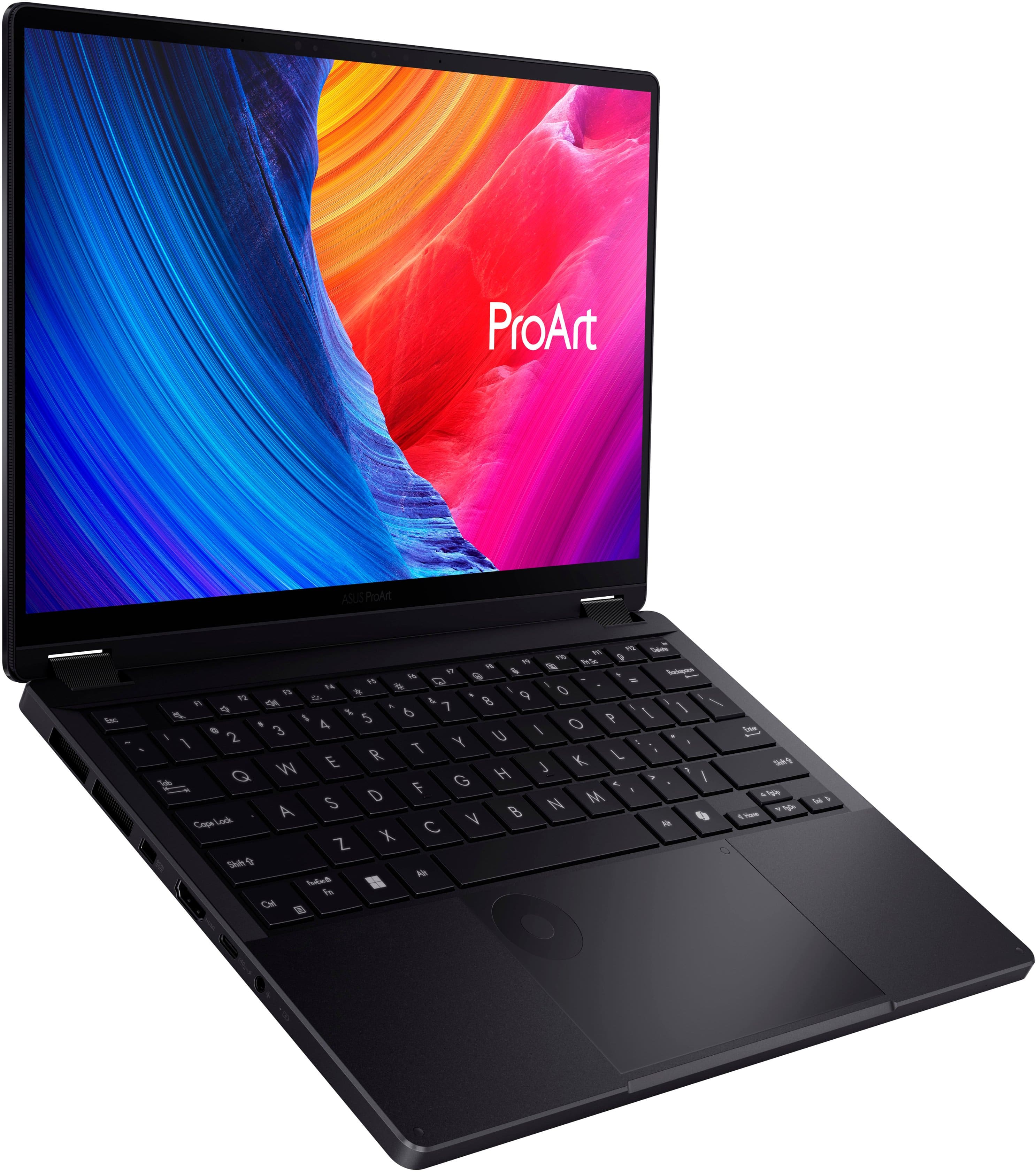 The image features a black laptop computer with a colorful background. The laptop is open, displaying the ProArt logo on the screen. The laptop's keyboard is visible, with the keys arranged in a neat and organized manner. The laptop is positioned against a white background, which highlights its sleek design and vibrant colors.