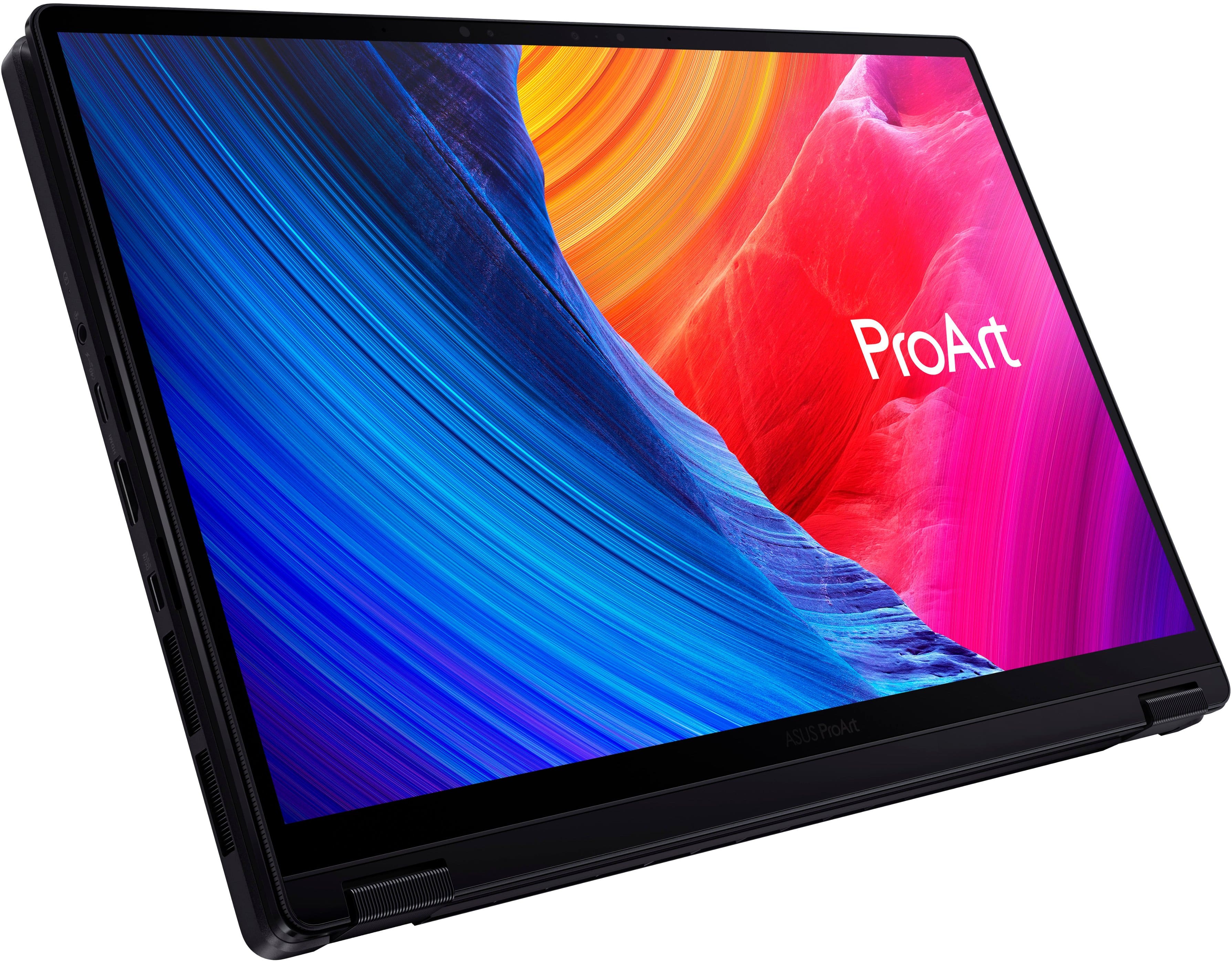 The image features a laptop computer with a colorful display screen, showcasing the ProArt brand. The laptop is open and ready for use.