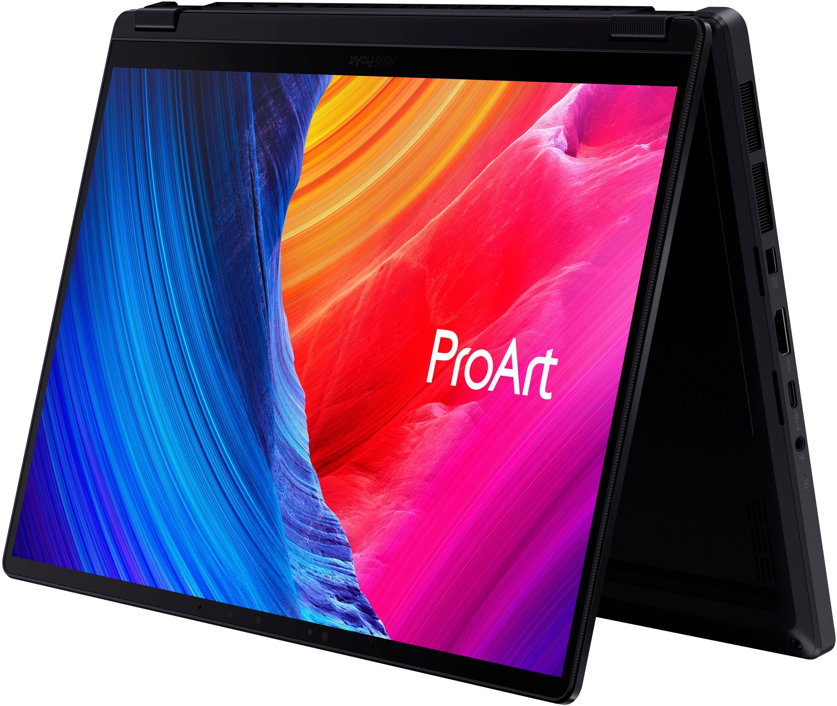The image features a laptop with a colorful background and the word "ProArt" displayed on the screen. The laptop is open, showcasing the vibrant colors and the ProArt branding. The screen is the main focus of the image, highlighting the laptop's design and features.