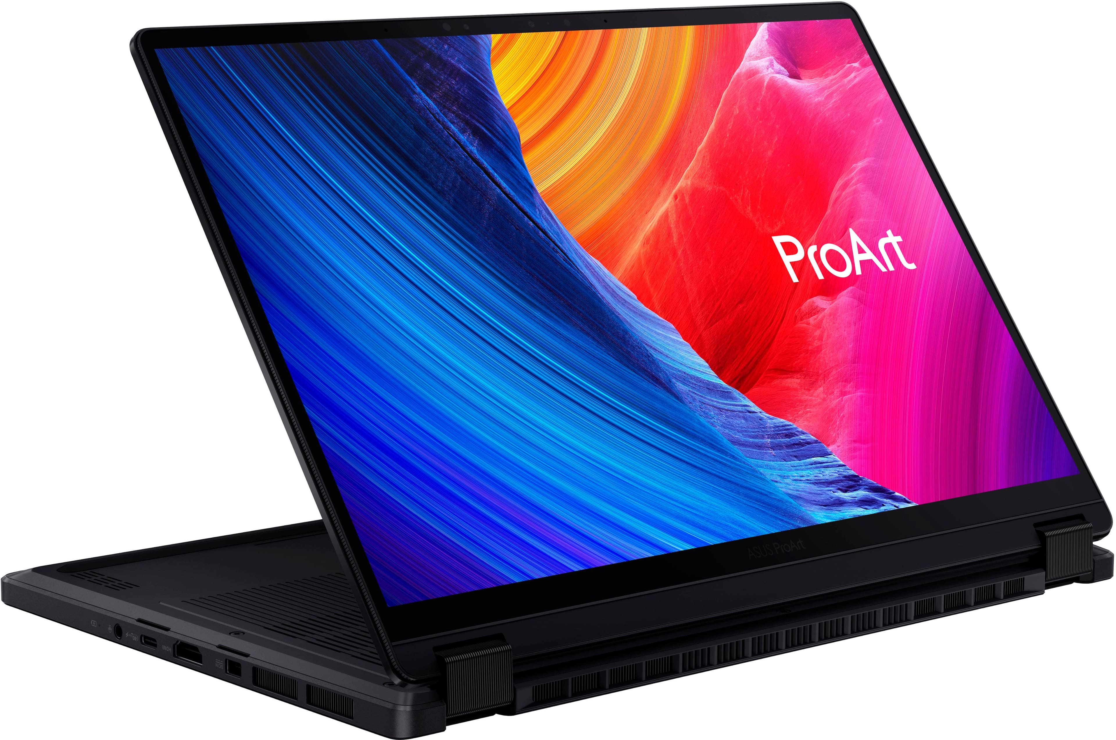 The image features a laptop computer with a vibrant and colorful background, which is likely a wallpaper. The laptop is open and ready for use. The text "ProArt" is displayed prominently on the screen, indicating that it is a ProArt laptop.