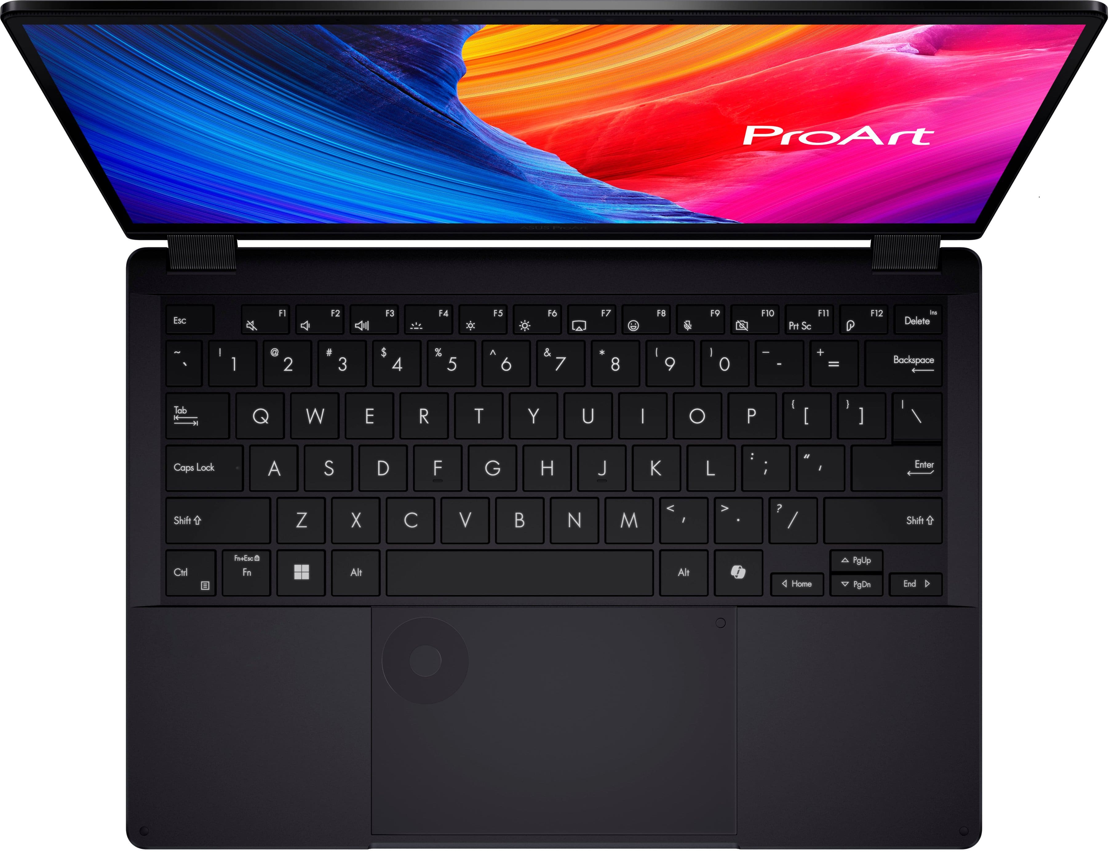 The image features a black laptop with a keyboard and a screen. The screen displays the word "ProArt" in red. The keyboard has a variety of keys, including letters, numbers, and function keys. The laptop is open and ready for use.