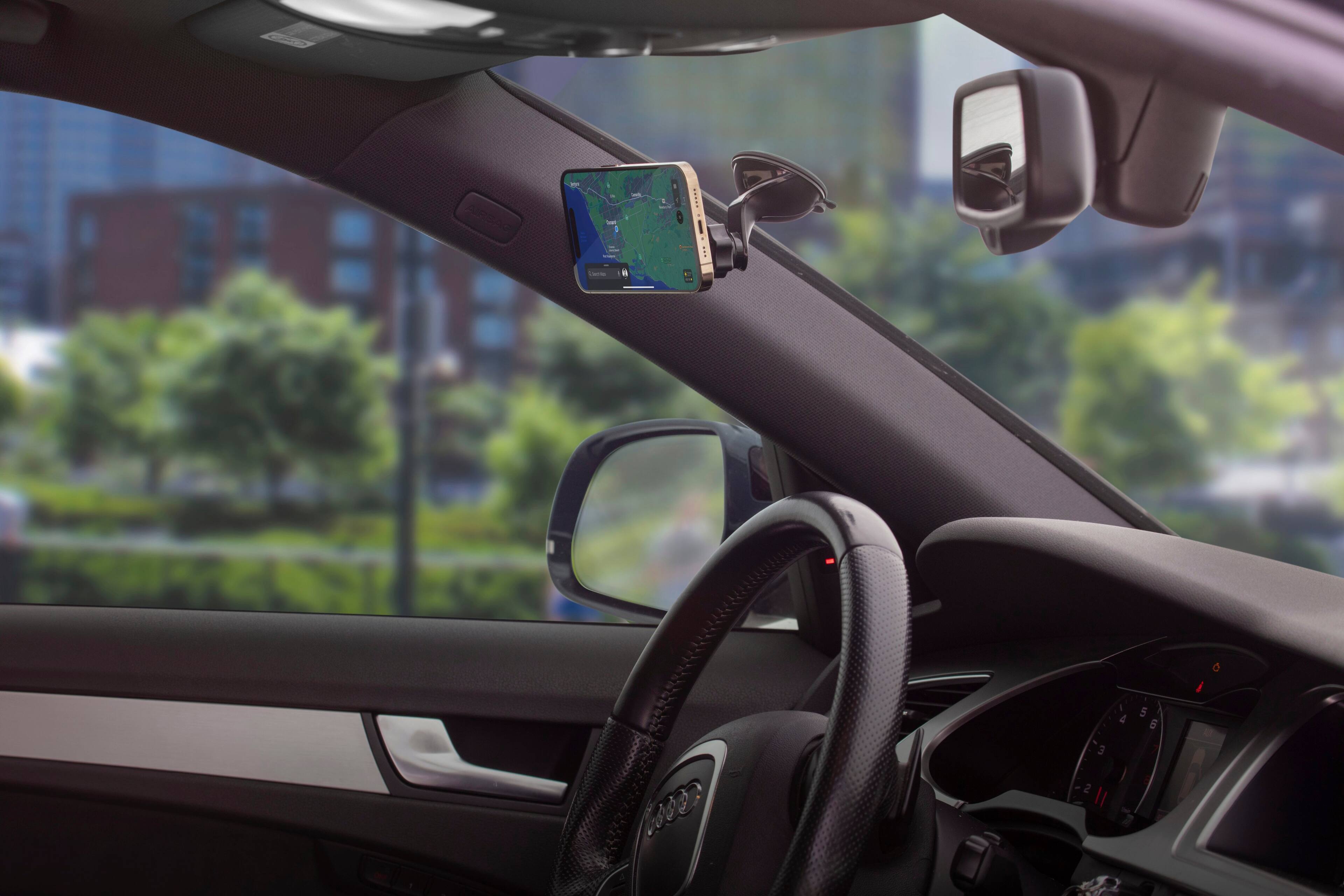 Cell Phone Mounts:

1. A cell phone holder attached to the car's dashboard.
2. A cell phone holder attached to the car's windshield.
3. A cell phone holder attached to the car's sun visor.
4. A cell phone holder attached to the car's steering wheel.
5. A cell phone holder attached to the car's dashboard.