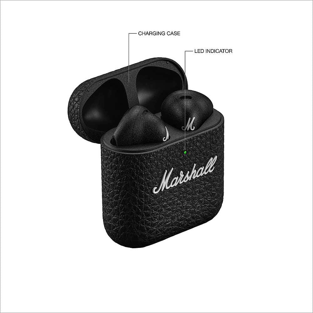 The image shows a black charging case for a pair of earbuds, with a green LED indicator. The case is made by Marshall and is designed to hold the earbuds when they are not in use. The case is open, revealing the earbuds inside.