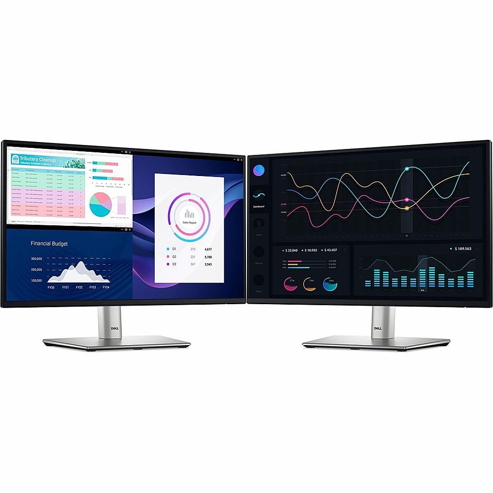 The image features two computer monitors side by side, each displaying different data. One of the monitors is showing a graph with various data points, while the other monitor displays a chart with different graphs. The monitors are placed on a desk, and there is a keyboard in front of them. The image also features a clock on the wall, indicating the time.