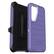 The image features a purple Otterbox case for a cell phone. The case is designed to protect the phone from drops and impacts, and it has a sleek, modern appearance. The case is open, revealing the phone inside. The Otterbox brand is prominently displayed on the case, indicating its quality and durability. The case is designed to fit snugly around the phone, providing a secure fit and protection for the device.