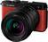 The Lumix camera is a compact digital camera with a 20-60mm lens. It has a 1:3.5-5.6 zoom ratio and a 16.1 megapixel sensor. The camera is red and black in color.