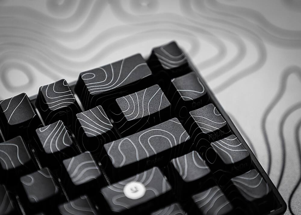 The text on the image is in Spanish, so I cannot group and correct the text. However, I can provide the English translation for the given text: "Del Enfer PgUp PgDn". This text is a combination of two phrases in Spanish. "Del Enfer" means "From Hell," and "PgUp PgDn" are the keyboard shortcuts for the "Page Up" and "Page Down" keys, respectively.