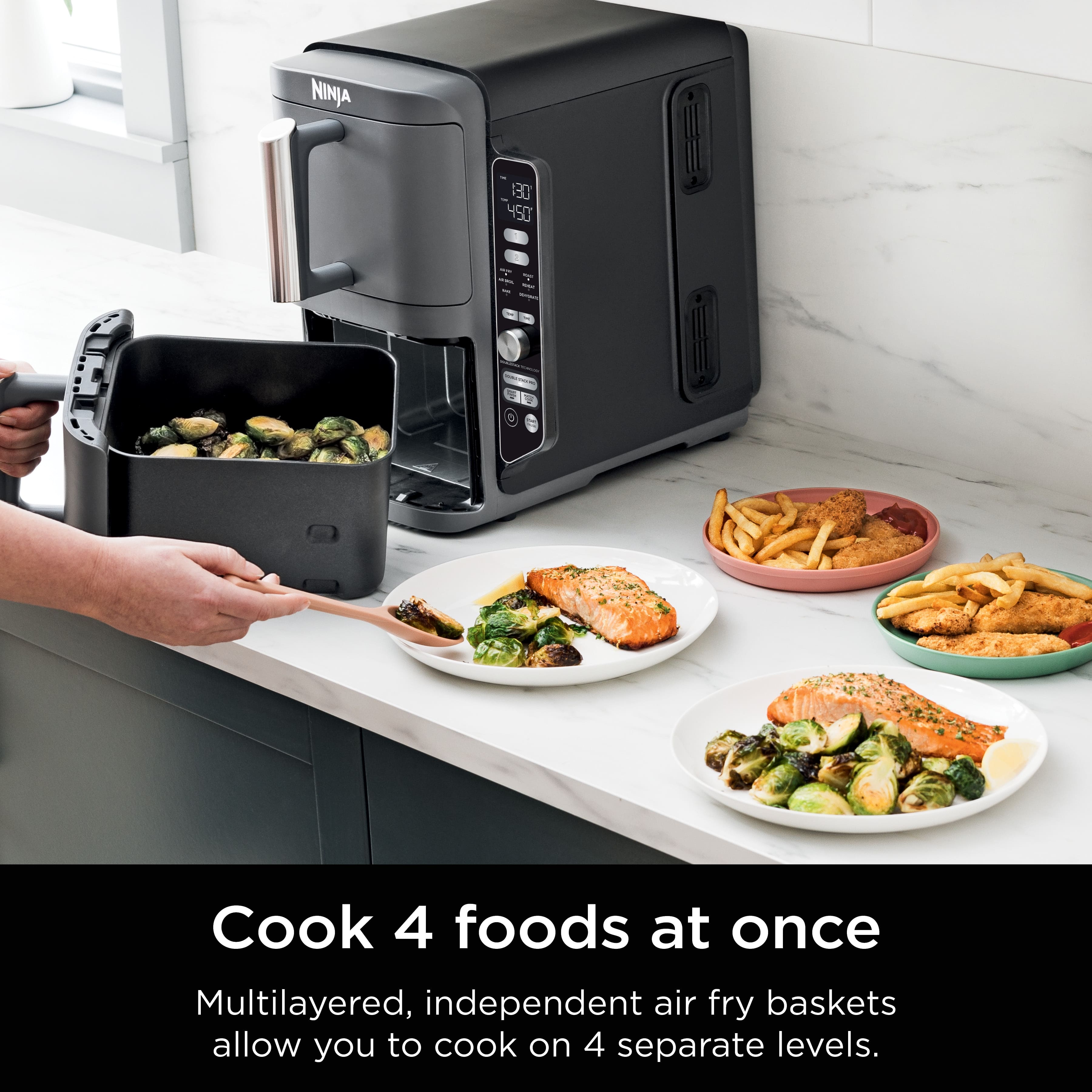 NINJA 130 450 - Cook 4 foods at once Multilayered, independent air fry baskets allow you to cook on 4 separate levels.