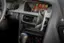 The image shows a car's dashboard with a cell phone attached to the dashboard. The phone is displaying the time as 9:41. The car has a steering wheel and a clock on the dashboard. The car is equipped with an Audi multimedia system, which includes features such as phone, music, maps, and messages. The car's interior is designed with comfort and functionality in mind, offering a pleasant driving experience.