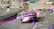 The image is a video game scene featuring a car racing game. The car is driving on a road with a purple background, and there are other cars in the scene as well. The game has a timer that shows 320 seconds remaining. The car is also equipped with a nitro boost, which can be activated to enhance its speed and performance during the race. The image captures the excitement and action of the video game, showcasing the car's movement and the overall gameplay experience.