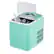The image features a small, white and turquoise ice maker with a clear door. The ice maker is filled with ice and has a container of ice in it. The ice maker is open, revealing the ice inside.
