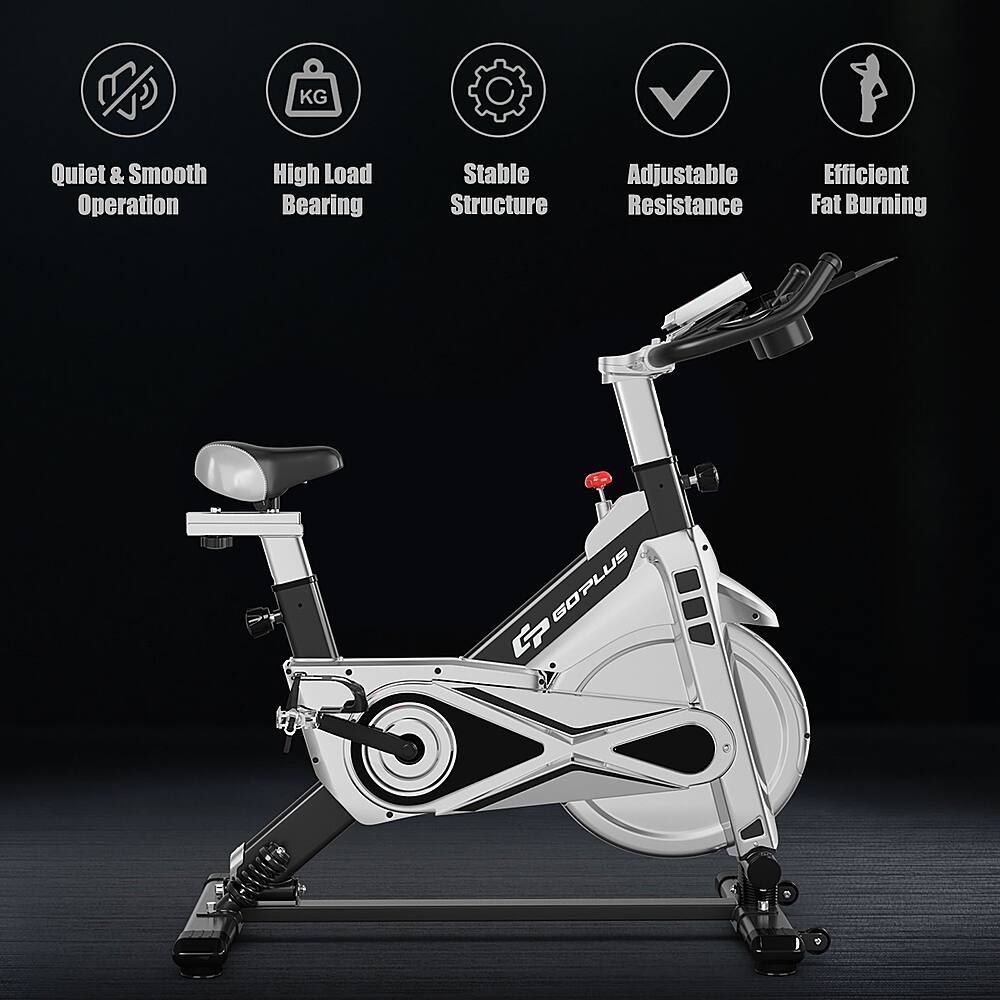 The text on the image describes the features of a stationary exercise bike. The bike is designed for quiet and smooth operation, with high load bearing capacity, stable structure, and adjustable resistance. It is also efficient for fat burning and has a Goplus G brand.