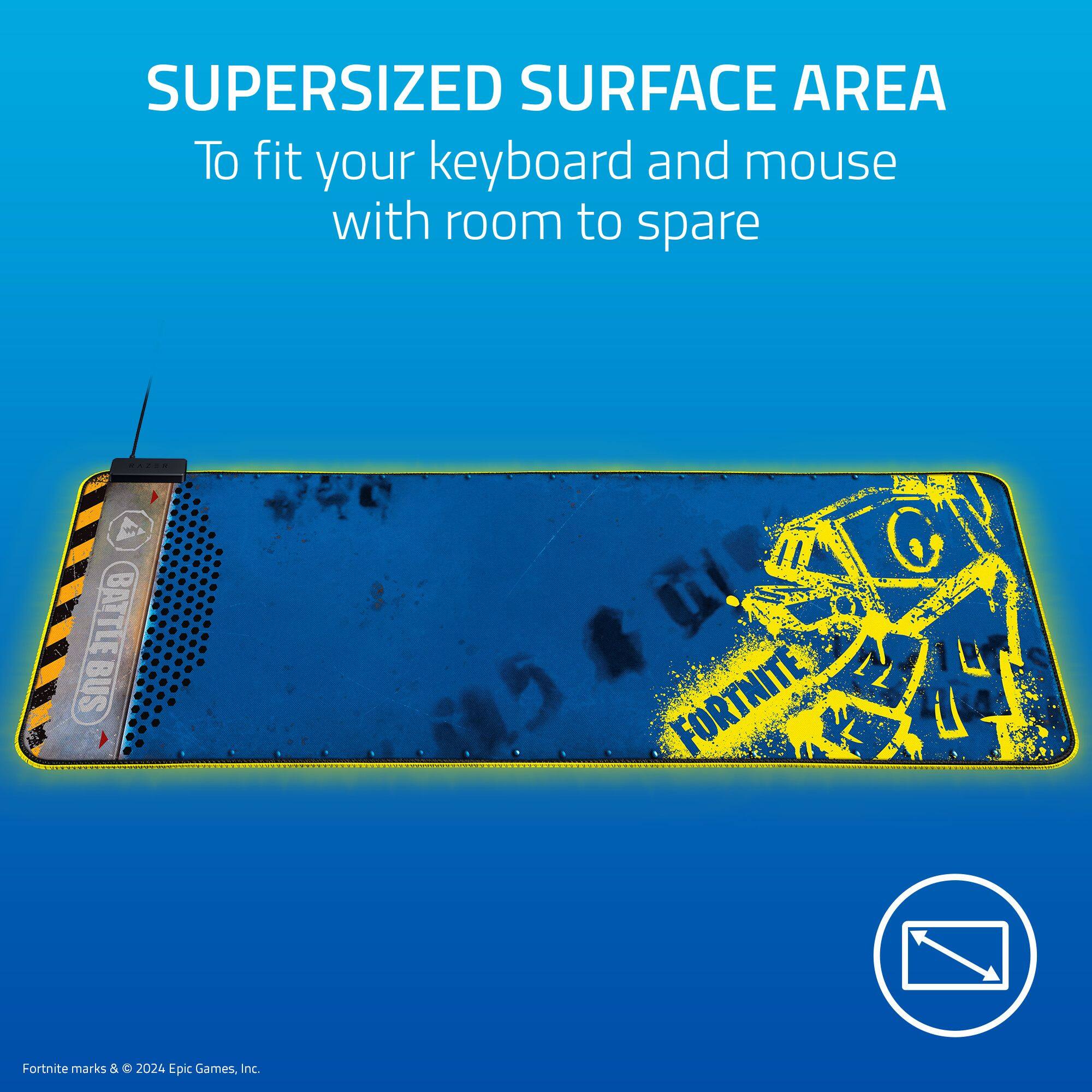 The image features a keyboard and mouse pad with a yellow and black design. The text on the image reads, "SUPERSIZED SURFACE AREA To fit your keyboard and mouse with room to spare." The pad is designed to provide ample space for the keyboard and mouse, ensuring a comfortable and efficient gaming experience. The Fortnite logo is also visible on the pad, indicating that it is a Fortnite-themed product.