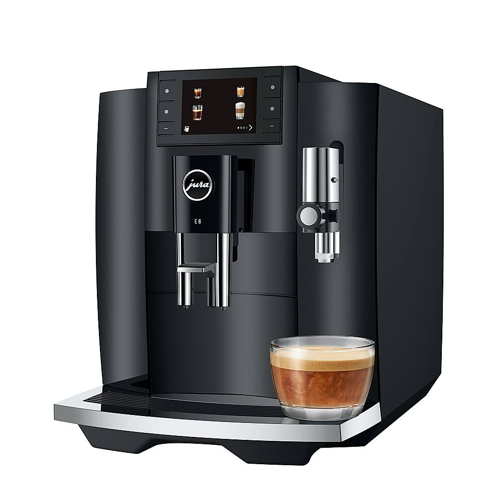 The image features a Jura E8 coffee machine, which is a modern and stylish appliance. The coffee machine is black and has a cup of coffee on top of it. The cup is filled with a delicious beverage, ready to be enjoyed by someone. The Jura E8 is known for its high-quality coffee and user-friendly interface, making it a popular choice among coffee enthusiasts.