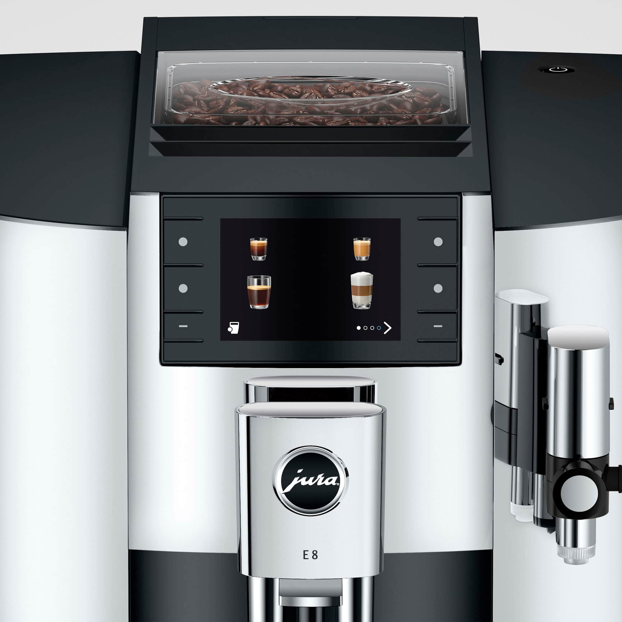 The image features a Jura E8 coffee machine, which is a modern and sophisticated coffee maker. The machine has a large glass container on top, where coffee beans are placed, and it also has a digital display. The coffee maker is designed to make coffee in various ways, including espresso, cappuccino, and latte. The machine is equipped with a bean hopper, which holds the coffee beans, and a coffee grinder that grinds the beans to the desired consistency. The Jura E8 coffee maker is a high-quality and versatile option for coffee lovers who want to enjoy a variety of coffee drinks at home.