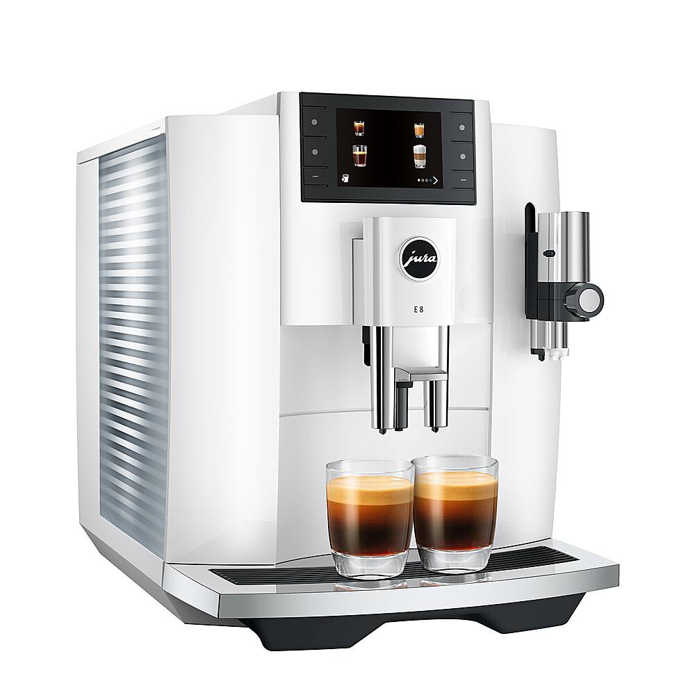 The image shows a Jura E8 coffee machine with two cups of coffee on its tray. The coffee machine is white and has a digital display. The cups are placed on the tray, ready to be filled with coffee. The machine is designed to make coffee and espresso drinks, providing a convenient and efficient way to enjoy a hot beverage.