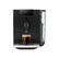 The image features a Jura coffee machine with a cup of coffee on top of it. The coffee maker is black and silver, and it has a glass of coffee sitting on top of it. The cup of coffee is placed in the coffee maker, and the machine is ready to serve a delicious beverage.