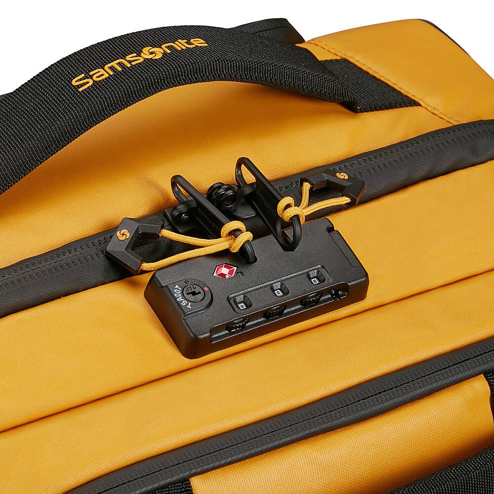 Samsonite is the brand of the yellow and black suitcase.