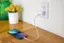 Charge your phone with this white charger.